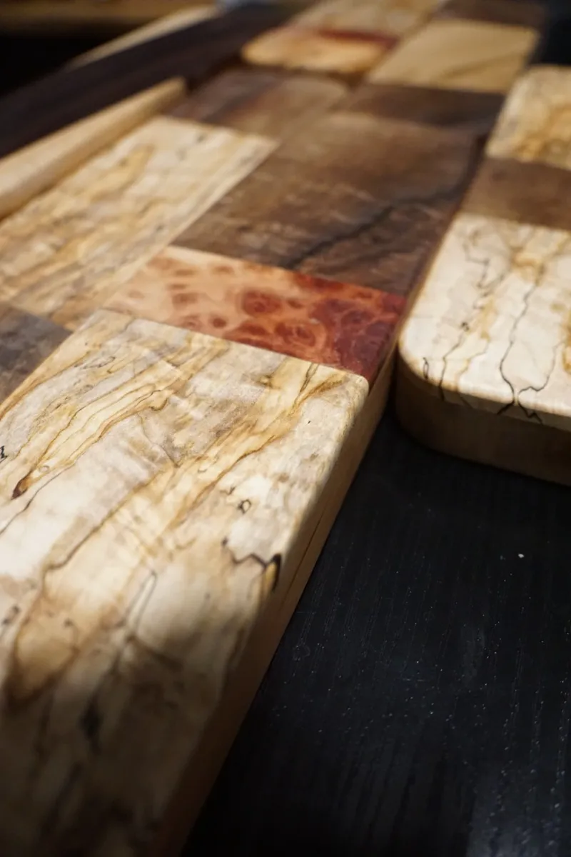 Eased edges and bare soles of finished clappers, stacked