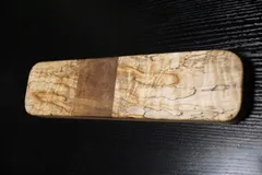 Rectangular clapper of heavily spalted maple with a plain walnut band across the center
